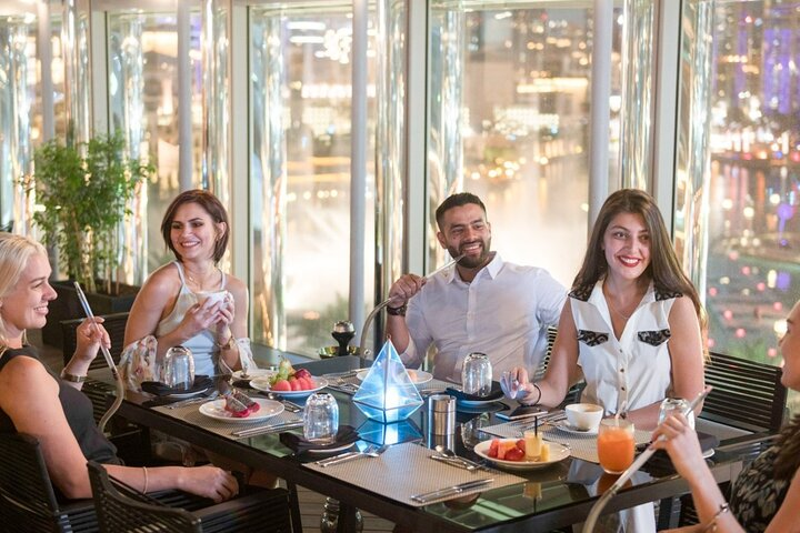 Savor delightful dishes while enjoying sweeping views of Dubai's skyline creating lasting memories in a setting that seamlessly blends culinary excellence with breathtaking vistas.